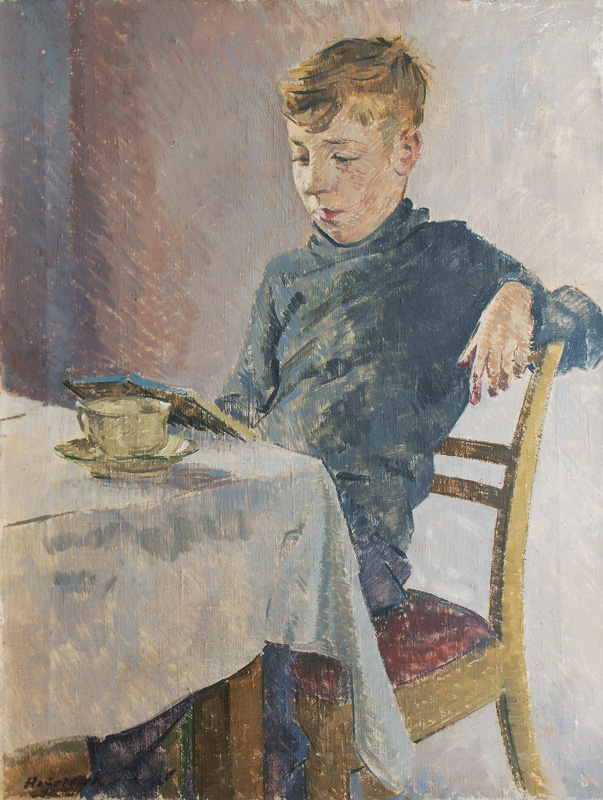 Boy reading at a Table