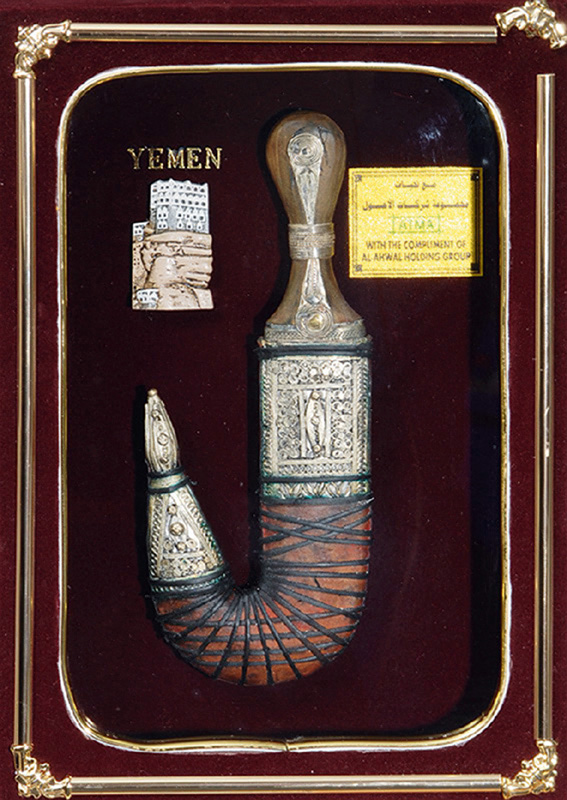 An oriental curved dagger in a show case