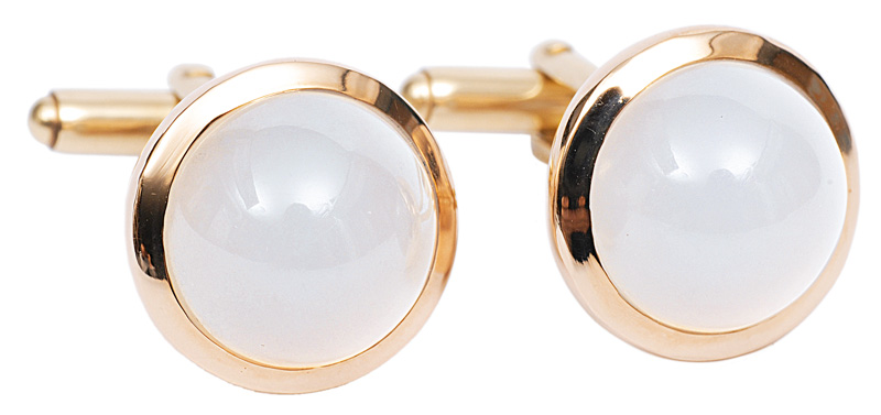 A pair of cuff links with moonstone