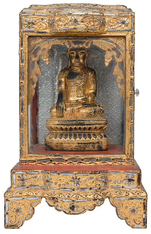 An altar shrine with seated Buddha