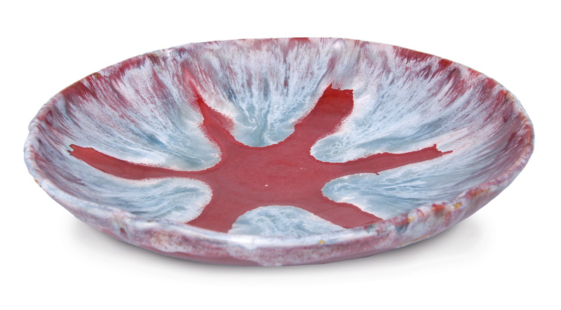 An Art Nouveau bowl with oxblood red running glaze