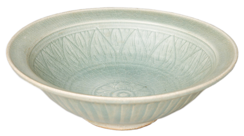 A celadon bowl with blossom relief