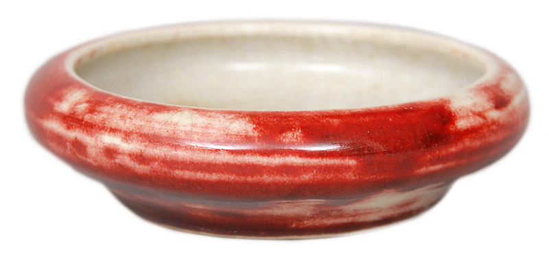 A small brush bowl with sang de boef glaze