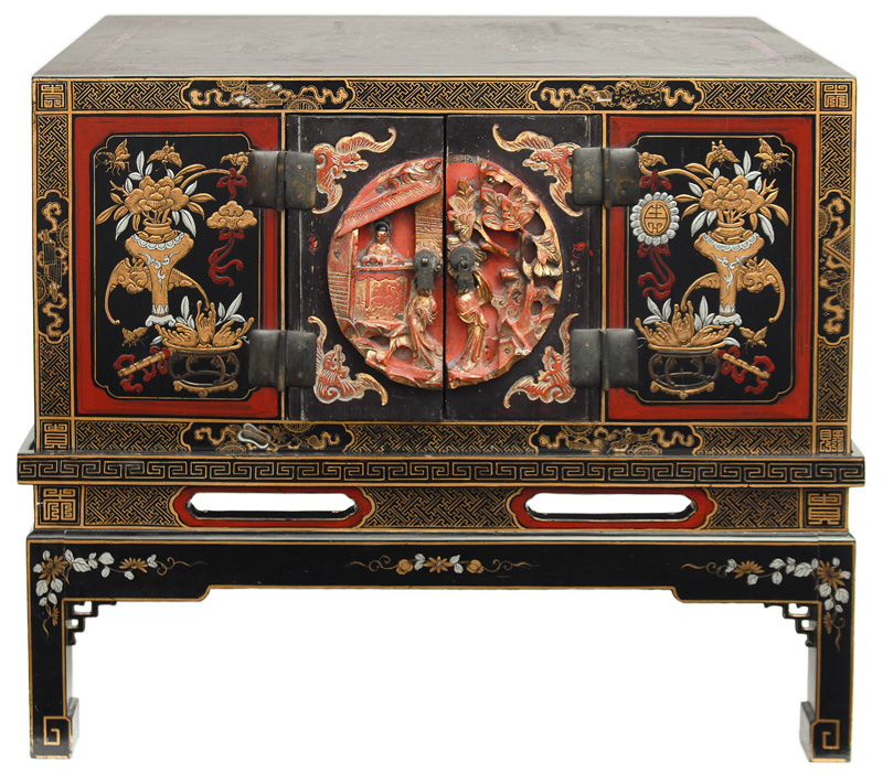 A cabinet with figural laquer painting