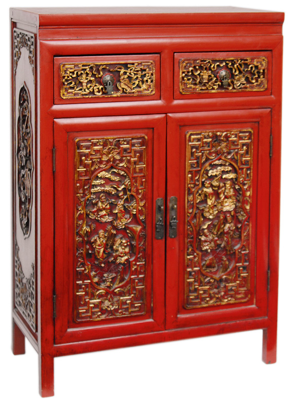A red laquer cabinet with carved decoration