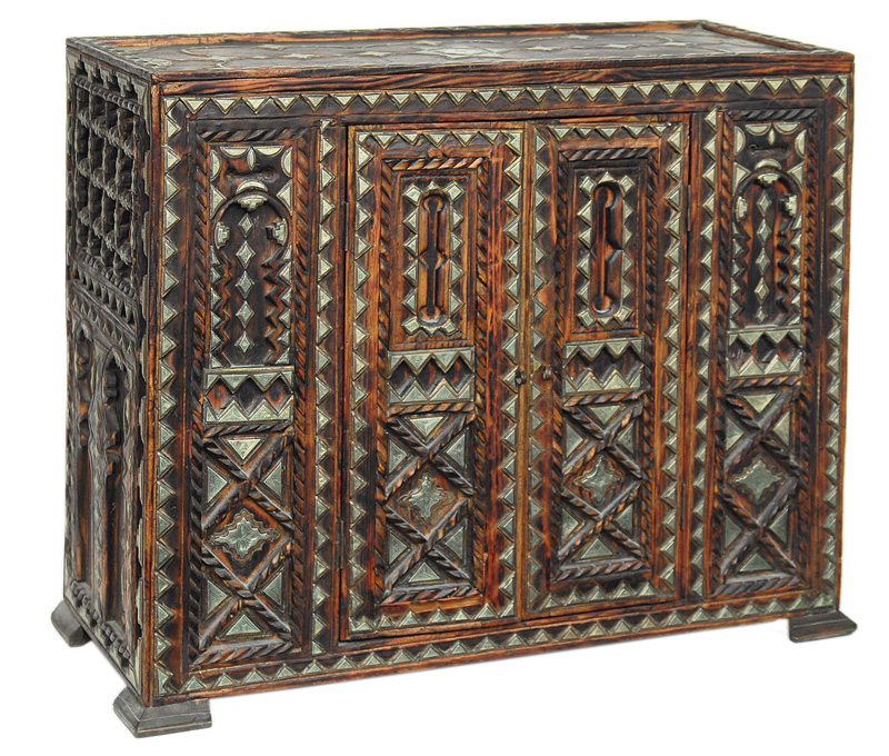 An oriental cabinet with metal application
