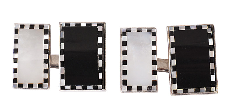 A pair of only mother-of-pearl cuff links
