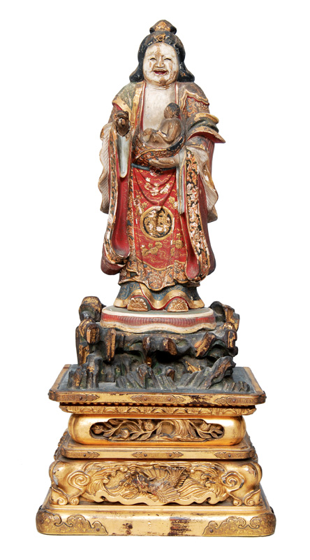 A standing Kannon/ Kariteimo holding a bady