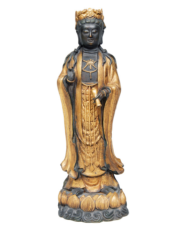 A standing bronze Guanyin on lotus base