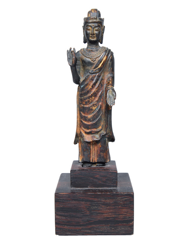 A standing bronze Buddha