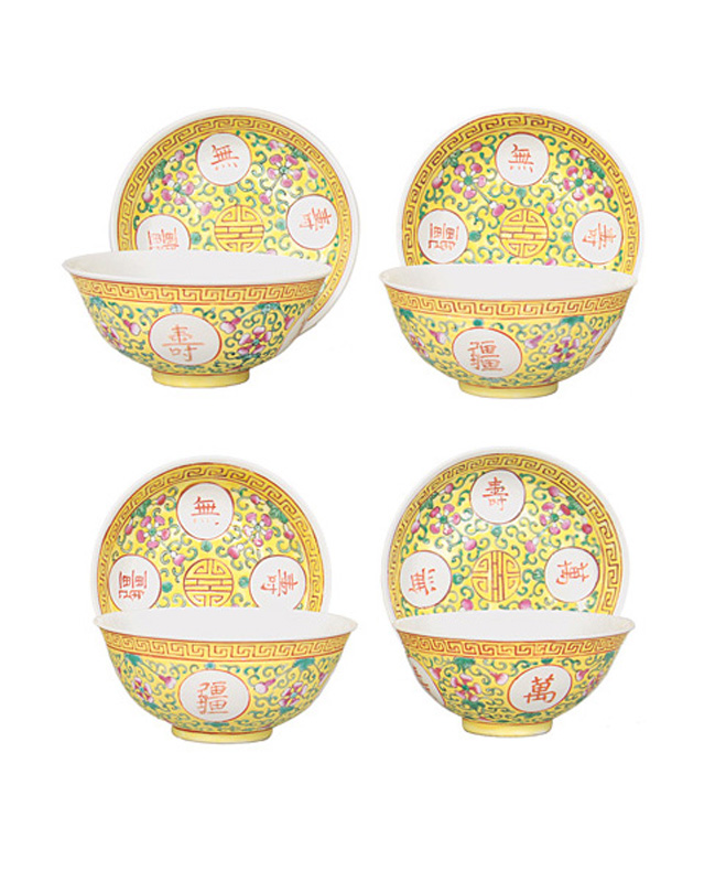 A set of 4 Famille jaune rice bowls and saucers