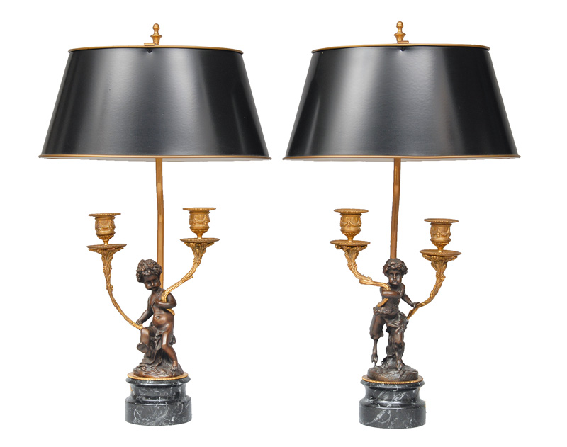 A pair of table lamps with bronze putti