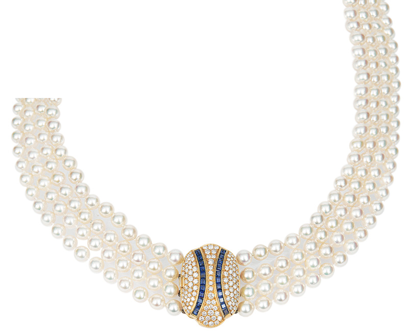 An elegant pearl necklace with a sapphire-diamond-clasp