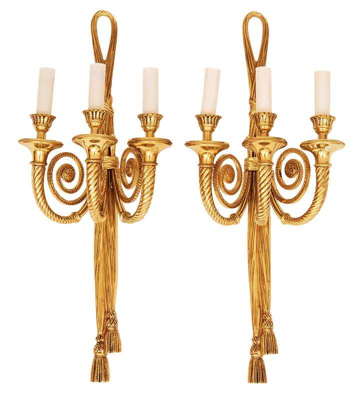 A pair of wall lights in the style of Louis Seize