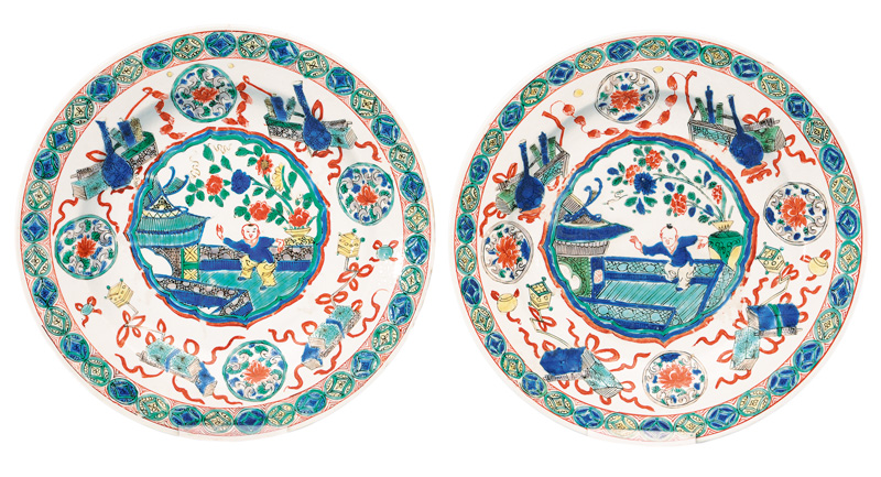 A pair of Famille-Verte plates with terrace scene