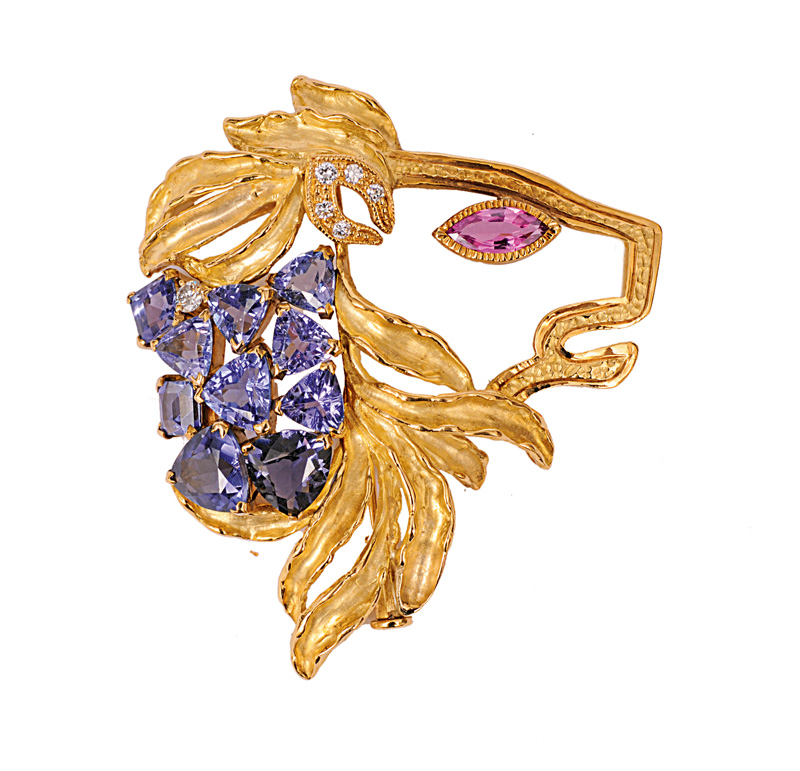 A tansanite brooch with pink sapphire and diamonds