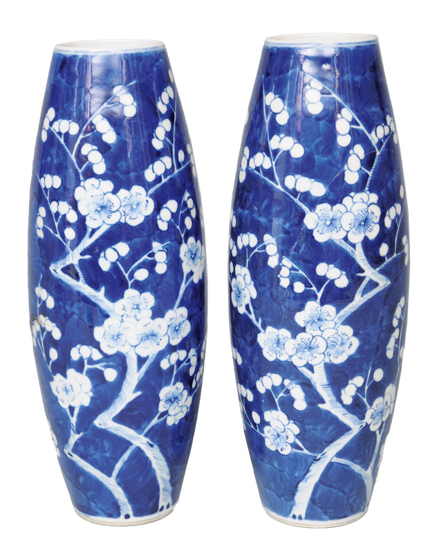 A pair of cylindrical vases with plum blossoms