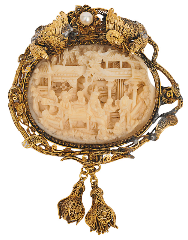 A pendant with ivory-carving