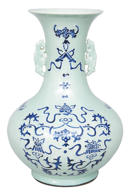 A celadon vase with Buddhist symbols