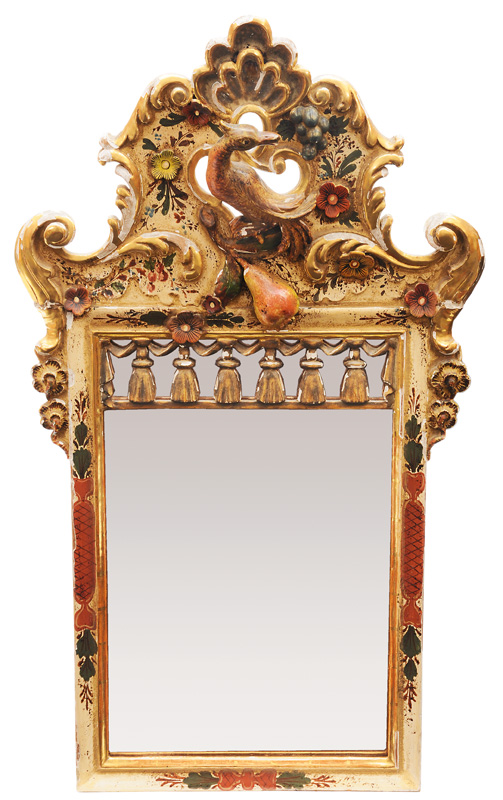A coloured mirror with bird carving