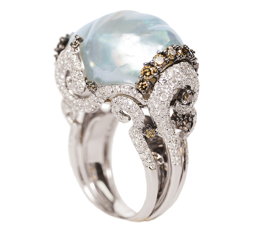 A baroque shaped Southsea pearl ring with diamonds