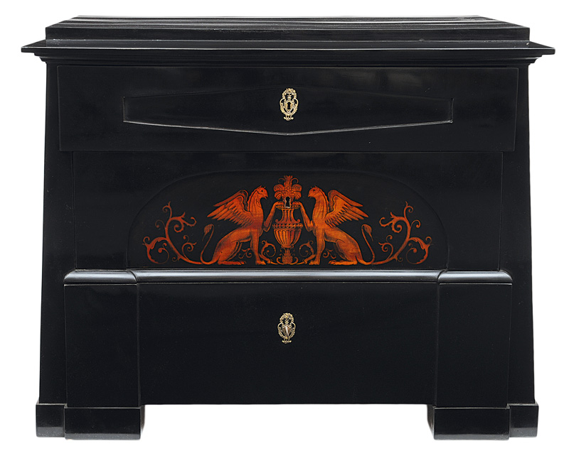 A pair of  black laquered chest of drawers with griffon decor