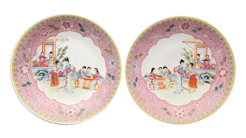 A pair of large Famille-Rose plates with garden scene