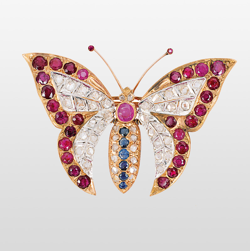 A butterfly brooch with rubies, diamonds and sapphires