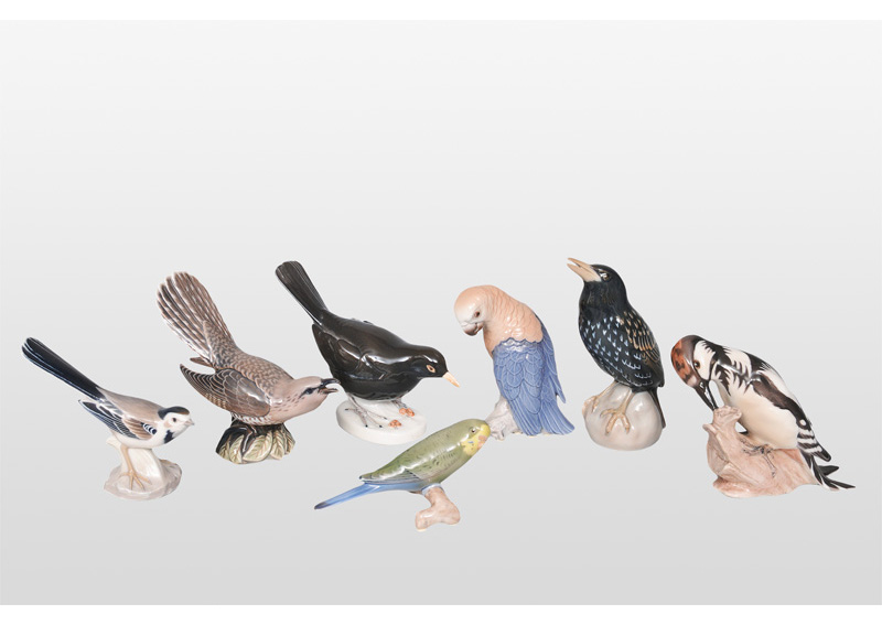 A set of 7 bird figurines