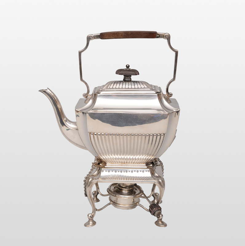 An Eduardian tea pot with rechaud