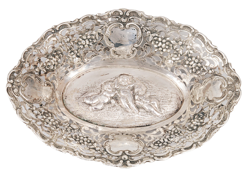 A small floral openworked bowl with putti scene