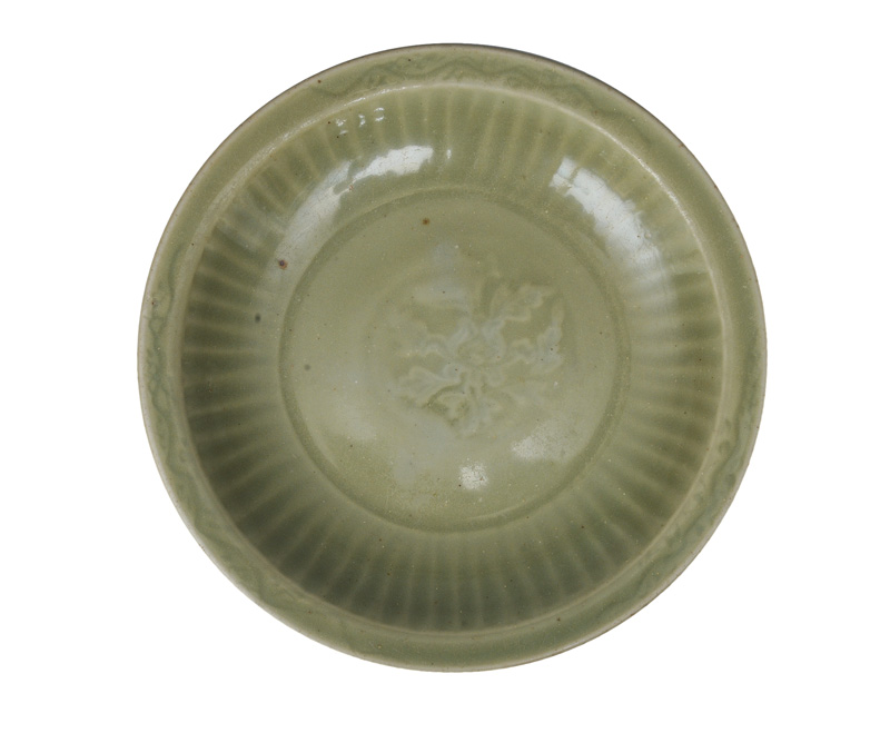 A celadon bowl with fine flower ornament