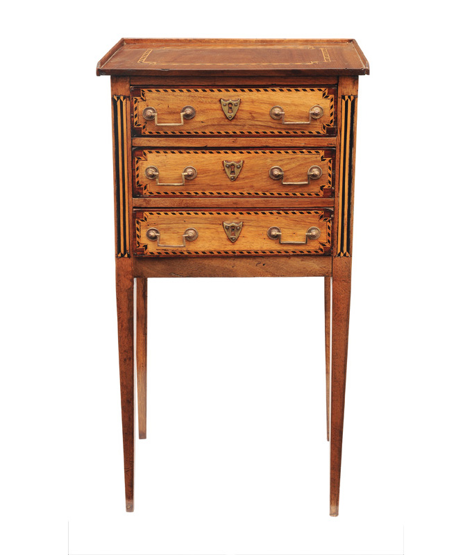 A small chest of drawers in the style of Louis Seize