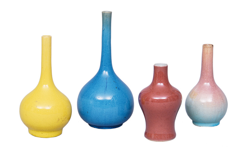 A set of 4 monochrome miniature vases