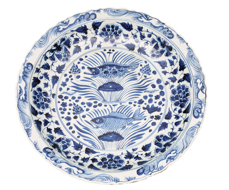 A very large circular platter with fish decoration