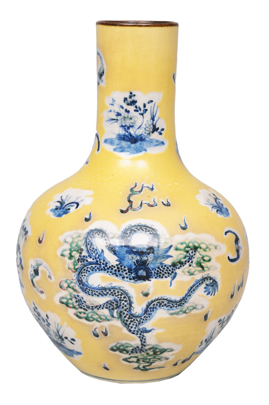A yellow vase with dragon and phoenix