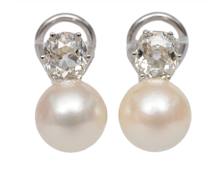 A pair of diamond pearl earstuds