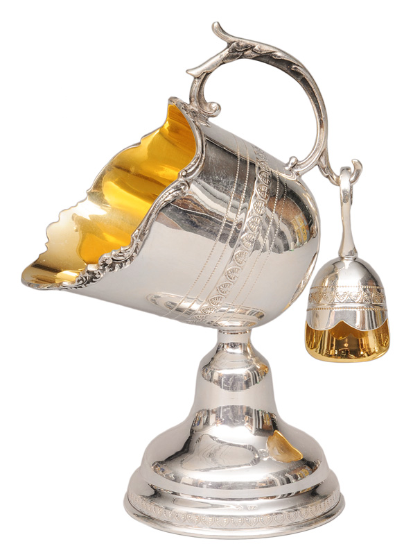 A sugar bowl with ladle
