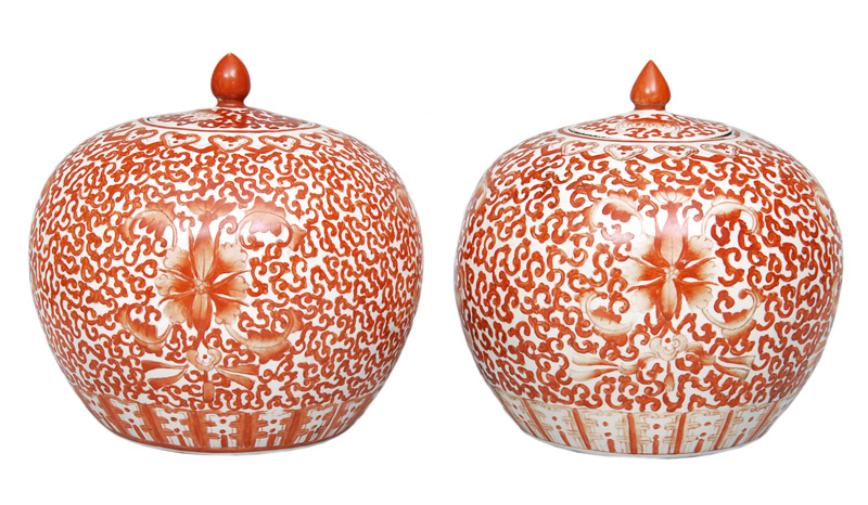A pair of iron-red globular vases with cover