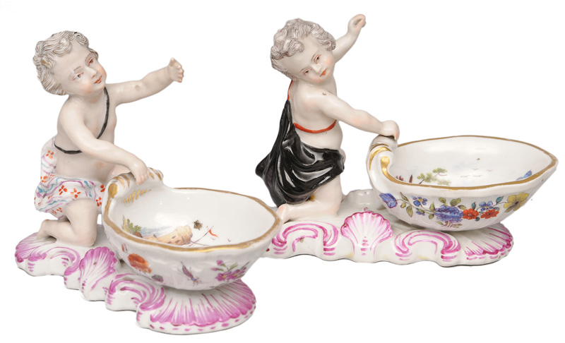 A pair of salt bowls with putti