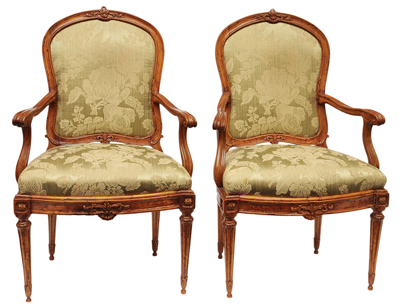 A pair of Louis Seize armchairs with fine carved decor of rosettes an foliage A pair of Louis Seize armchairs with fine carved decor of rosettes an foliage