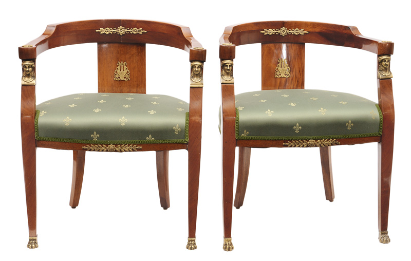 A pair of armchairs in the style of Empire