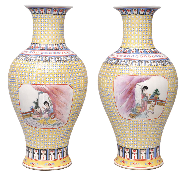 A pair of tall baluster vases