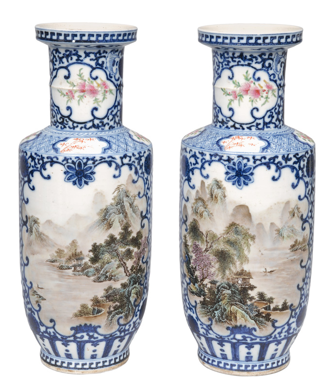 A pair of rouleau vases with landscapes