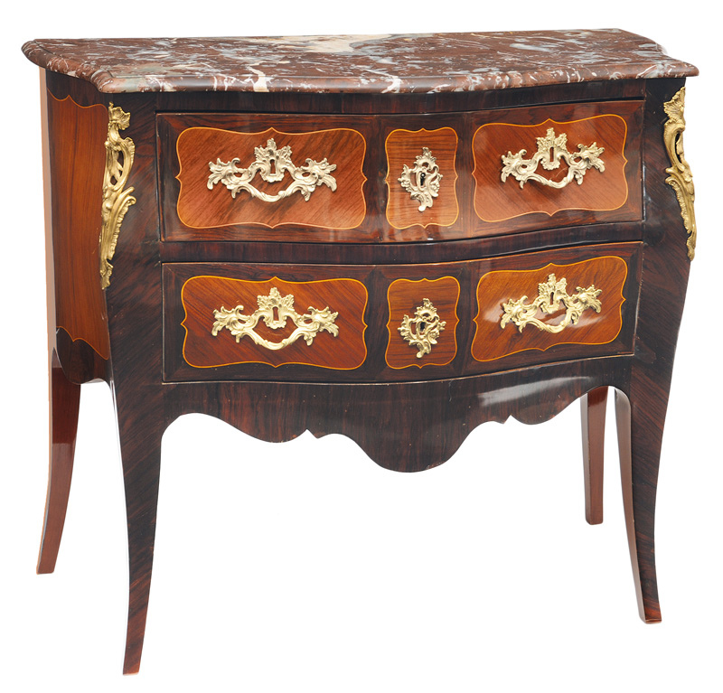 A chest of drawers in the style of Louis Quinze