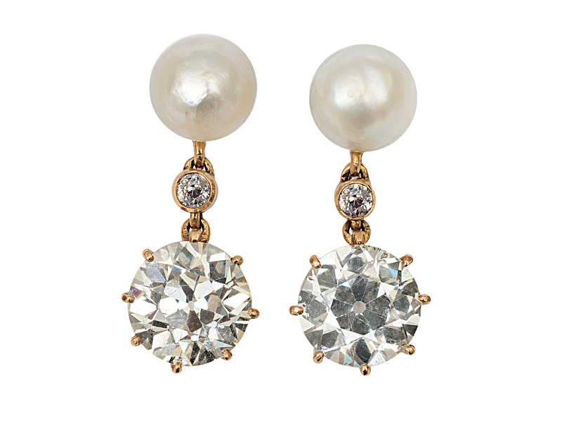 A pair of diamond pearl earrings