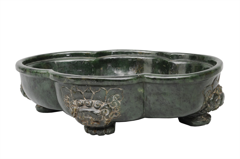 An exceptional large and impressive spinach green jade bowl