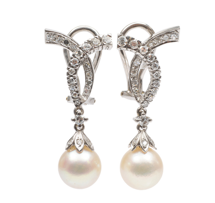 A pair of pearl diamond earrings