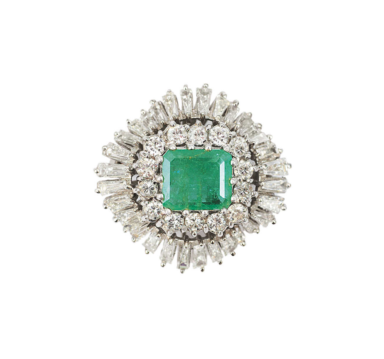 A small emerald diamond brooch