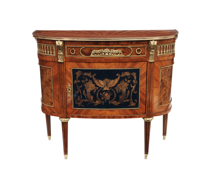 An elegant Demi Lune chest of drawers in the style of Louis-Seize